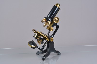 Lot 4 - An early 20th Century lacquered and black enamelled brass C Baker Jug Handle Compound Monocular Microscope