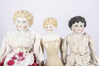 Lot 415 - Three late 19th century china shoulder head dolls