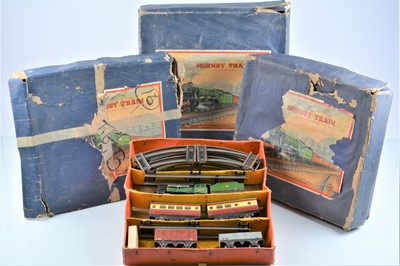 Lot 49 - Four post-war Hornby 0 Gauge Set Boxes and assorted Contents (qty)