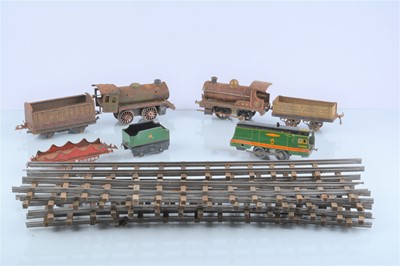 Lot 232 - A random selection of 0 Gauge clockwork Trains and Track