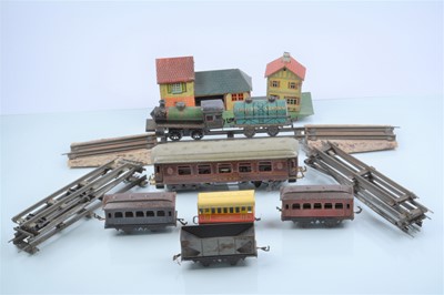 Lot 235 - An assortment of Bing and other 0 Gauge Trains and Accessories (qty)