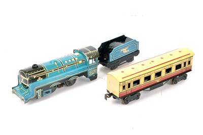 Lot 238 - A Marx (Swansea) 0 Gauge 3-rail electric Locomotive Tender and Coach (3)