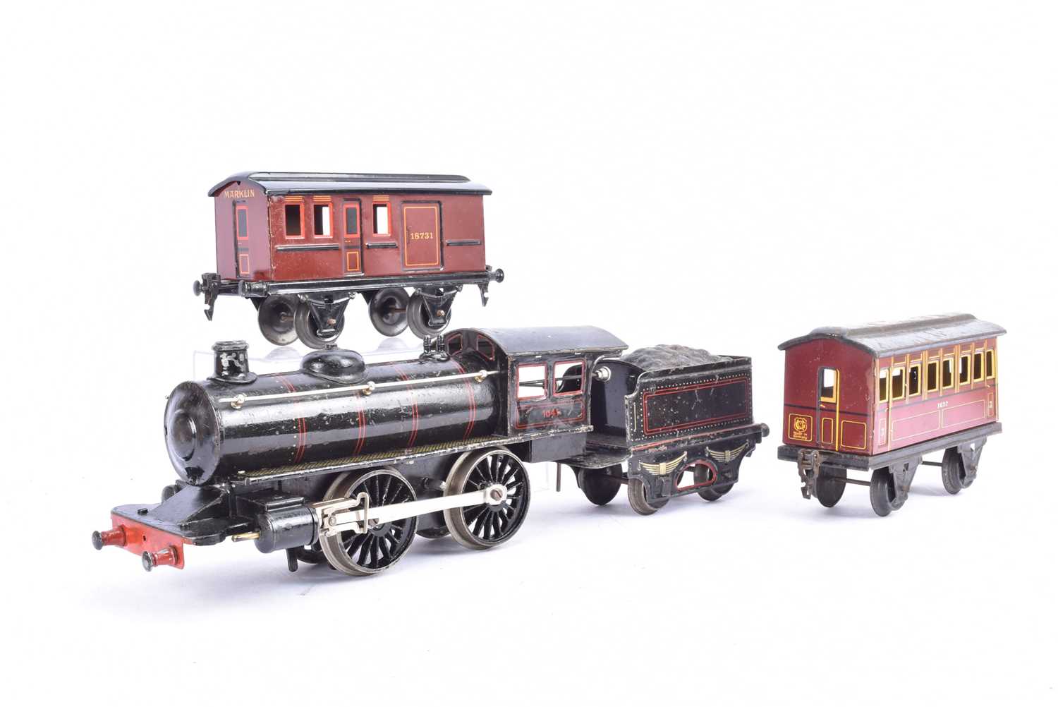 Lot 298 - A Marklin Gauge 1 clockwork Continental-style 0-4-0 Locomotive Tender and Coaches