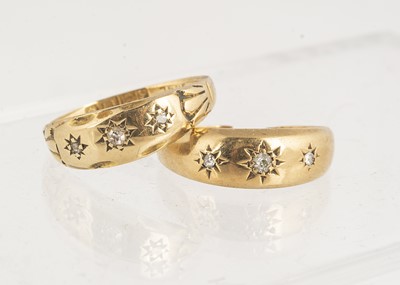 Lot 27 - An Edwardian 18ct gold and three stone diamond dress ring