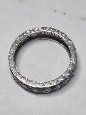 Lot 42 - A white metal sapphire and diamond full eternity ring