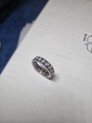 Lot 42 - A white metal sapphire and diamond full eternity ring