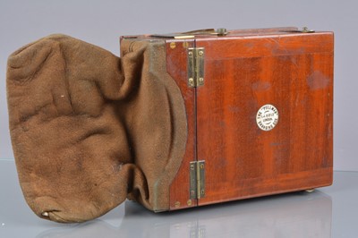Lot 97 - An early 20th Century Mahogany Brass and Suede Leather 'The "Pullman" Changing Box'