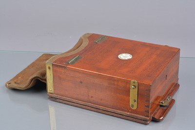 Lot 97 - An early 20th Century Mahogany Brass and Suede Leather 'The "Pullman" Changing Box'