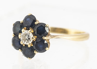 Lot 46 - An 18ct gold diamond and sapphire cluster dress ring