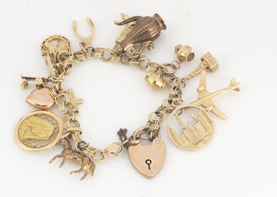 Lot 61 - A circular fancy link 9ct gold charm bracelet