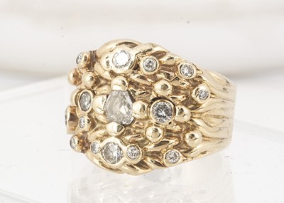Lot 68 - A 9ct gold and diamond encrusted dress ring