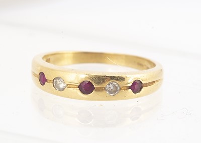 Lot 70 - An 18ct gold ruby and diamond dress ring