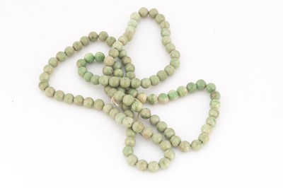 Lot 76 - A 19th Century green jadeite jade bead necklace