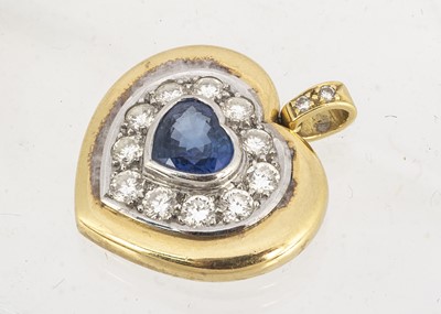 Lot 84 - An 18ct gold two colour sapphire and diamond heart shaped pendant