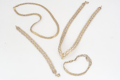 Lot 100 - A collection of two and three colour plaited 9ct gold necklaces and matching bracelets