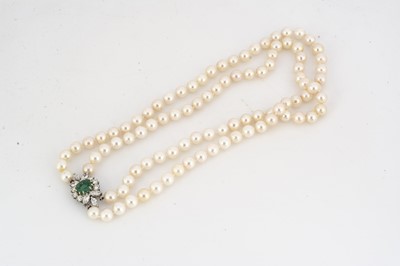 Lot 103 - An emerald and diamond cultured pearl double row twin set necklace
