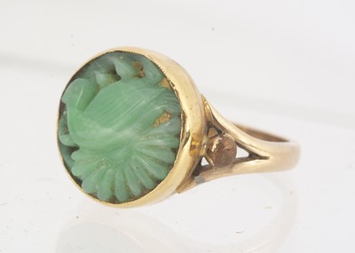 Lot 108 - A Chinese jadeite jade carved dress ring