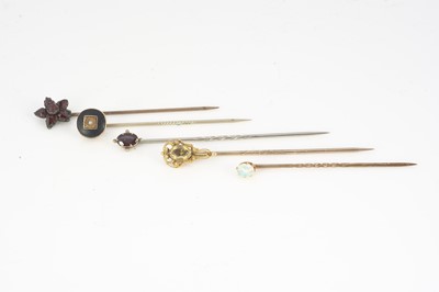 Lot 123 - A collection of gem set stick pins