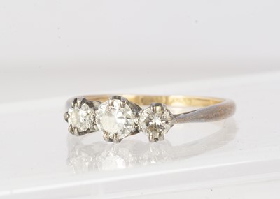 Lot 130 - A small 18ct and platinum three stone diamond ring