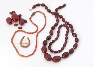 Lot 135 - A 'cherry amber' graduated knotted oval bead necklace