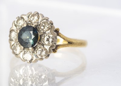 Lot 164 - An 18ct gold sapphire and diamond cluster ring