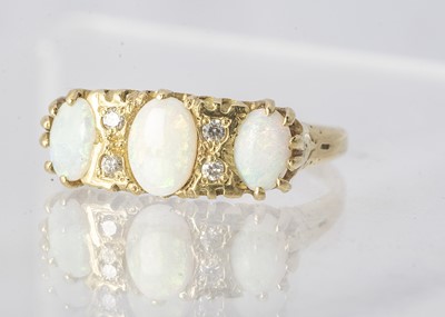 Lot 165 - An 18ct gold opal and diamond dress ring
