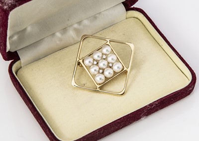 Lot 180 - A Mikimoto cultured pearl and diamond 14K marked yellow metal brooch