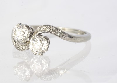 Lot 229 - An Art Deco old cut diamond and platinum cross over ring