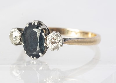Lot 231 - An 18ct gold and platinum set, sapphire and diamond three stone dress ring