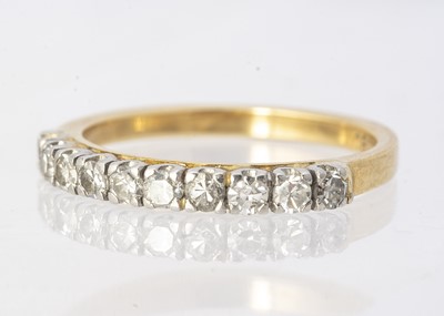 Lot 234 - An 18ct gold diamond half hoop eternity ring, the eight cuts in four claw settings, ring size P, 3.8g