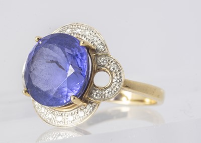 Lot 268 - An 18ct gold diamond and tanzanite dress ring