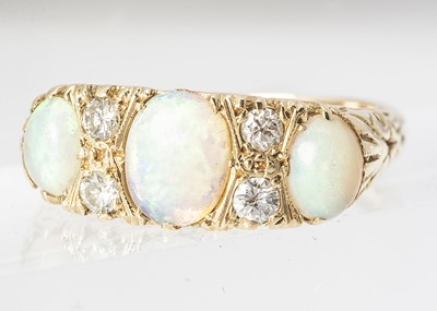 Lot 269 - An 18ct gold precious white opal and diamond ring