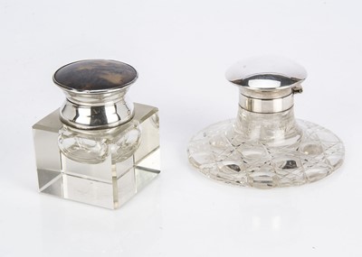 Lot 280 - Two George V period glass and silver mounted inkwells