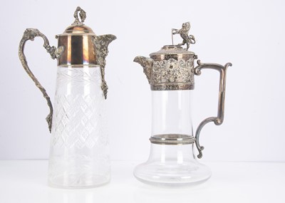 Lot 418 - Two Edwardian silver plated and glass claret jugs