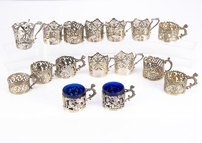 Lot 420 - A collection of sixteen silver small beaker holders