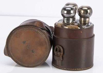 Lot 446 - An early 20th century leather cased set of travel bottles