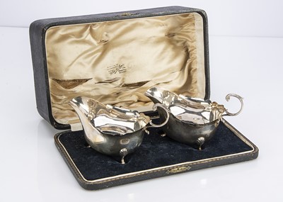 Lot 454 - A pair of cased George V silver sauce boats by ESB
