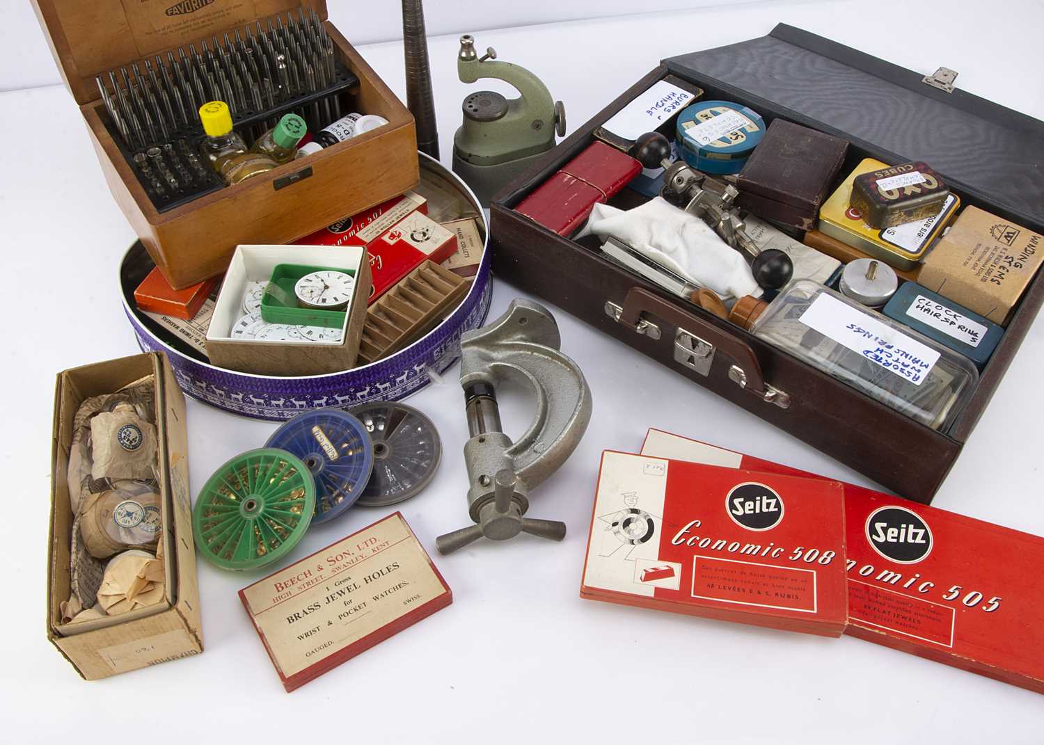 Lot 22 - A large collection of watch and clock spare parts and workshop tools and items