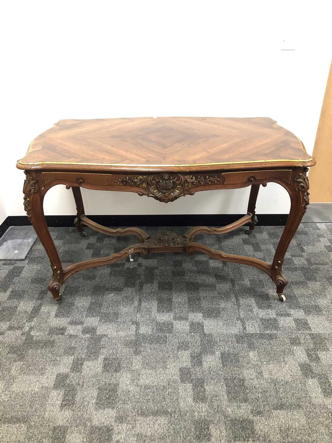 Lot 26 - A 19th century Continental crossbanded mahogany table