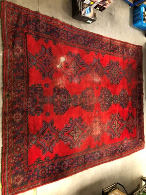 Lot 29 - A large and damaged colourful oushak woollen rug
