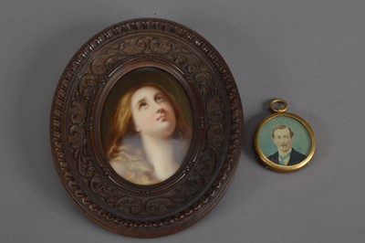 Lot 128 - A portrait of a lady on  oval ceramic tile