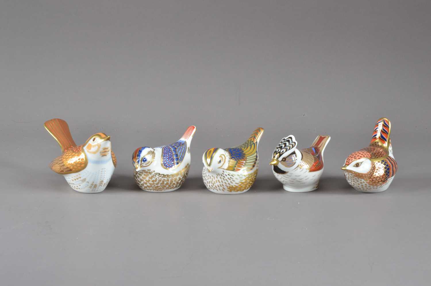 Lot 211 - Five bird Royal Crown Derby bone china paperweights