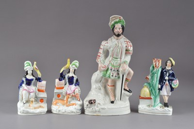 Lot 251 - A collection of 19th century Staffordshire figures and one spill vase