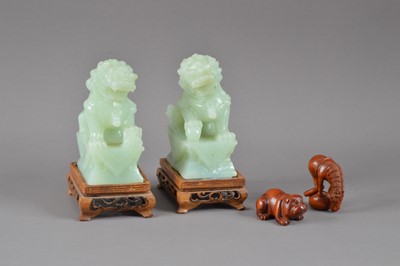Lot 275 - Two 20th century Chinese jade temple dogs