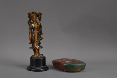 Lot 290 - A Chinese carved tiger eye figure of Guanyin