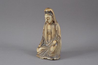 Lot 305 - A carved alabaster Buddha