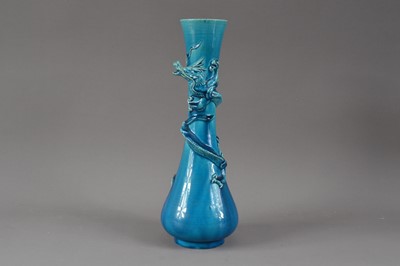 Lot 306 - A blue glazed ceramic dragon vase
