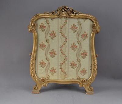 Lot 324 - A worn gilt gesso fire screen