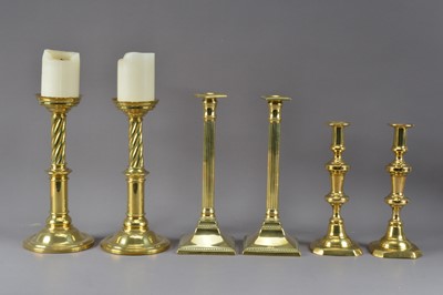 Lot 383 - Three pairs of brass candlesticks