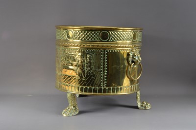 Lot 384 - A large brass footed planter